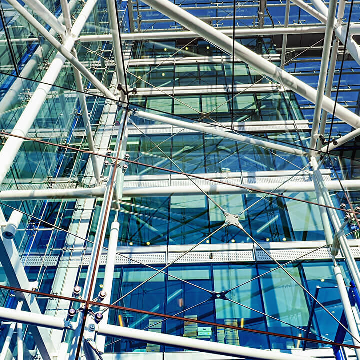Metallic pipes and cords construction in a building with big windows
