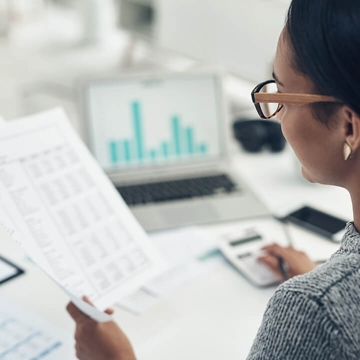 Closeup-shot-of-businesswoman-calculating-finances-